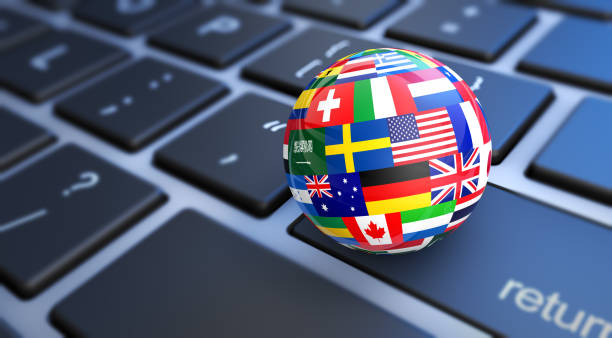Concept d'affaires internationales avec un clavier d'ordinateur et des drapeaux mondiaux sur un globe terrestre - secrétariat médical externalisé - Serenity